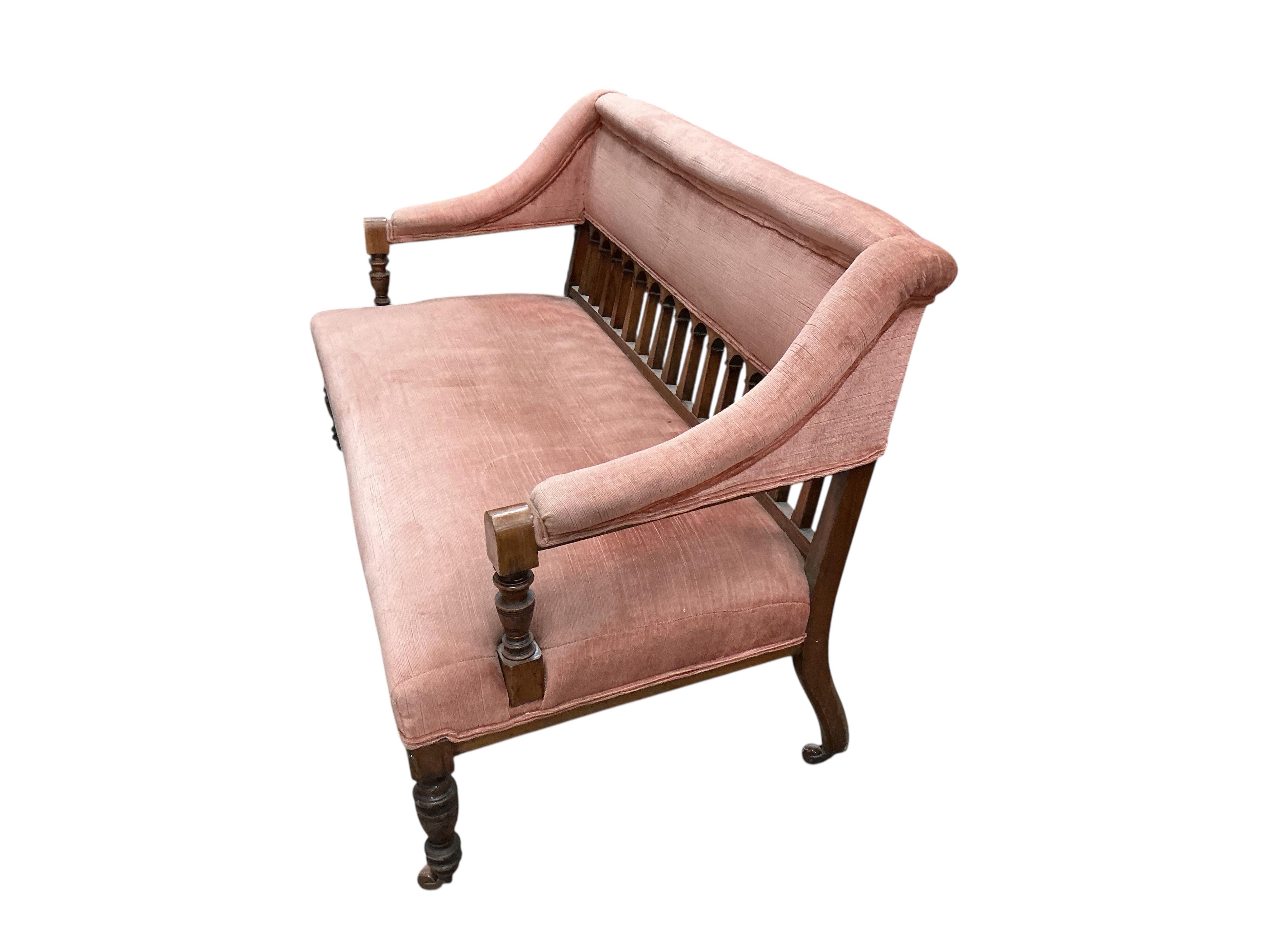 A late Victorian mahogany settee, width 128cm, depth 60cm, height 78cm.